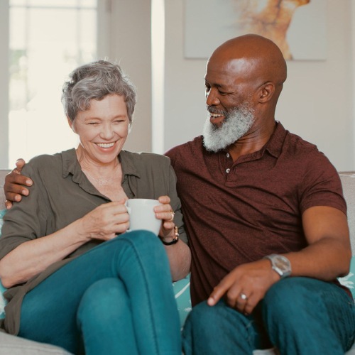 a couple sitting on a couch